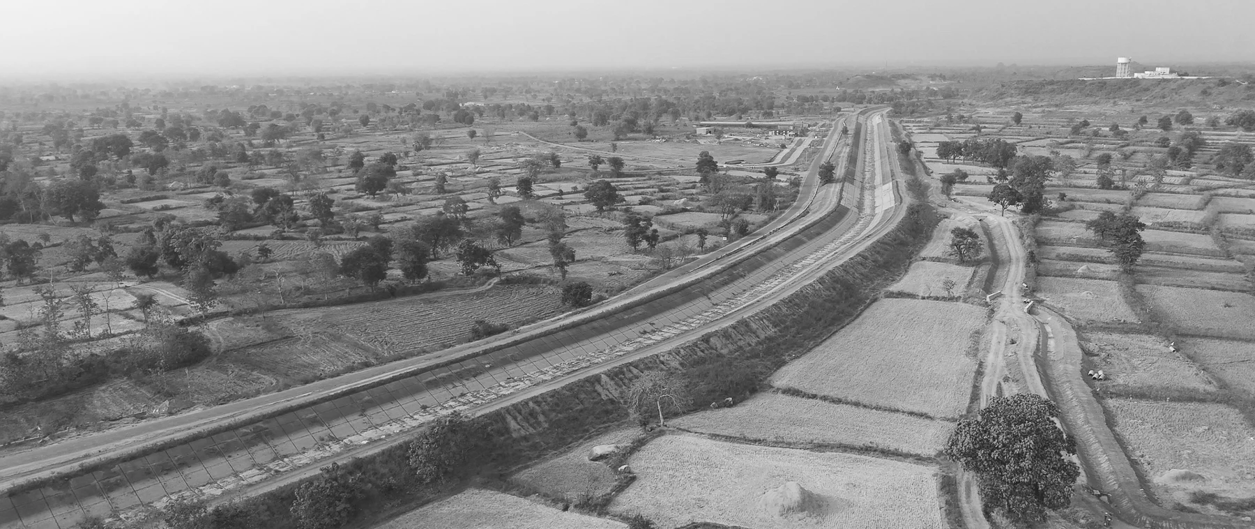 A canal cuts across fields and settlements.