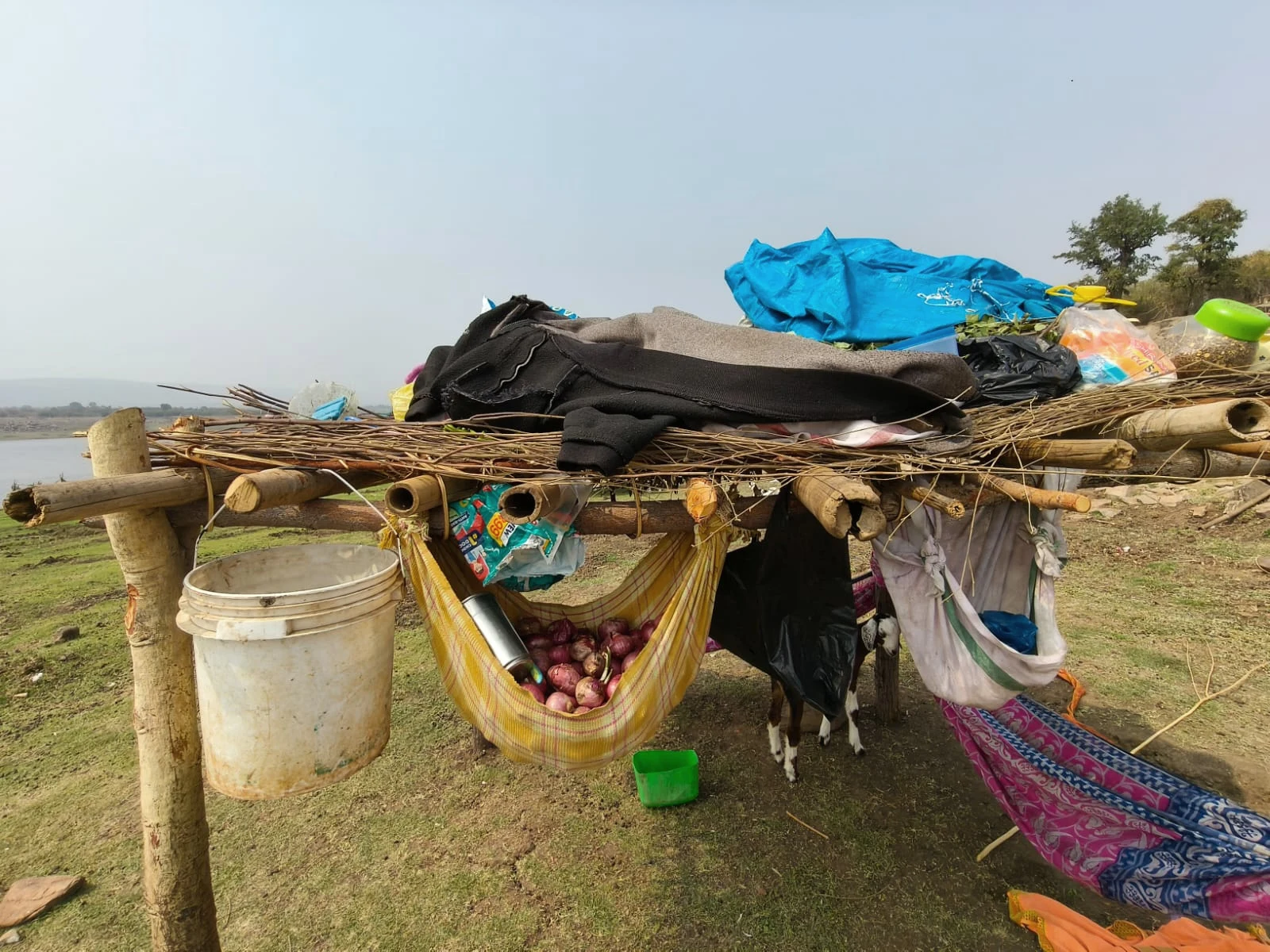 Household belongings stored outside a shelter.