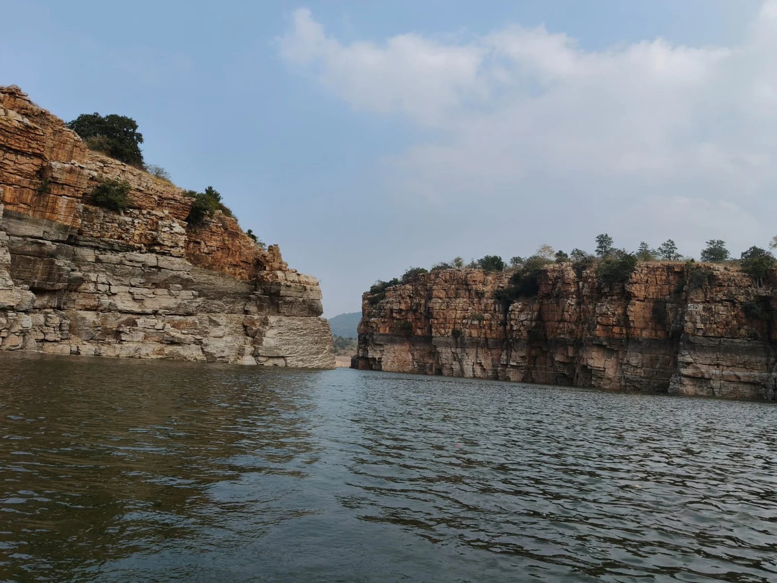 The Krishna River flows between steep rock formations.